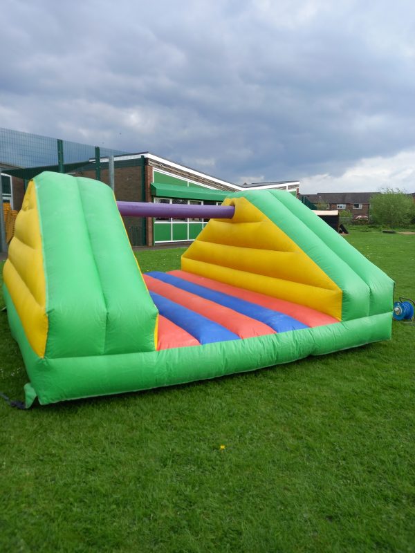 Inflatable Pillow Bash game with colorful sections and a central padded area for play.
